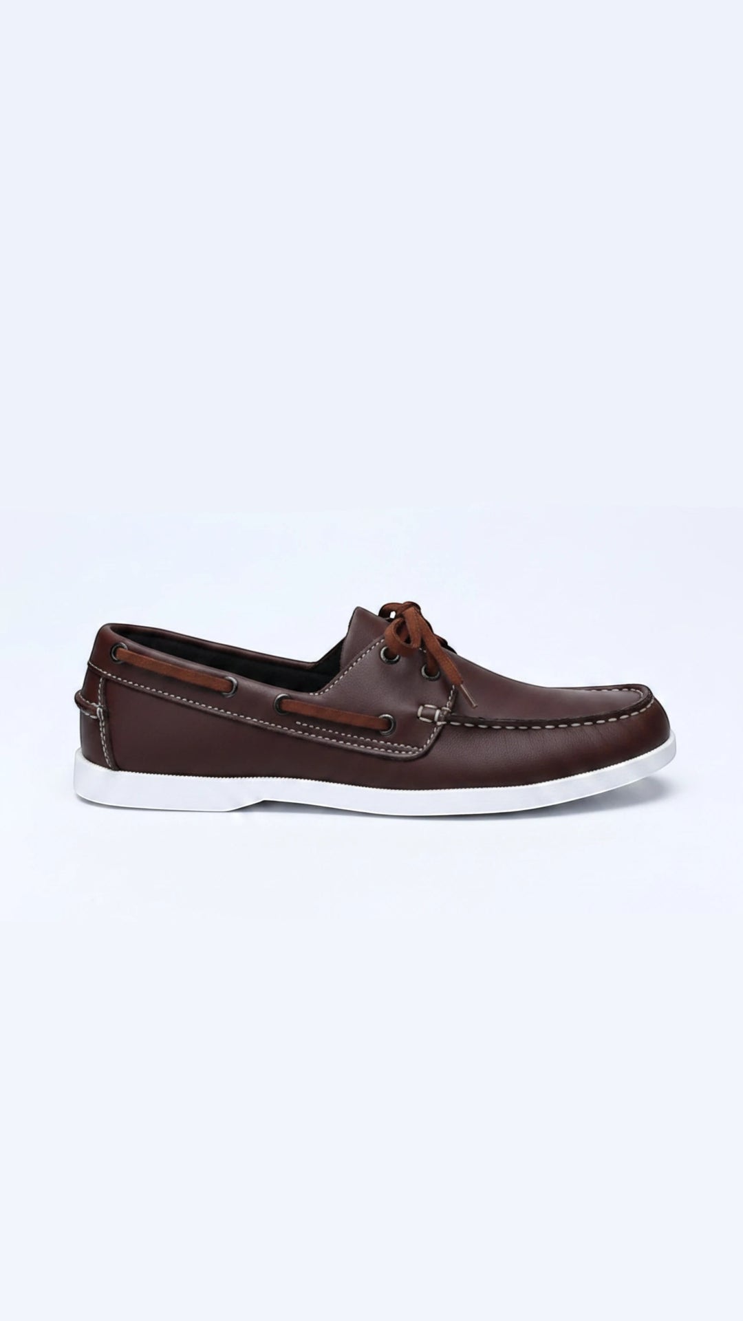 The Wool Company classic brown leather boat shoes with white contrast stitching and laces, featuring a non-slip white rubber sole.