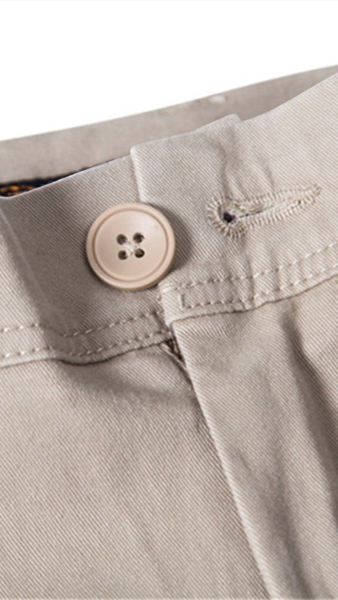 The Wool Company khaki chino trousers with a button and zip closure, made from 97% cotton.